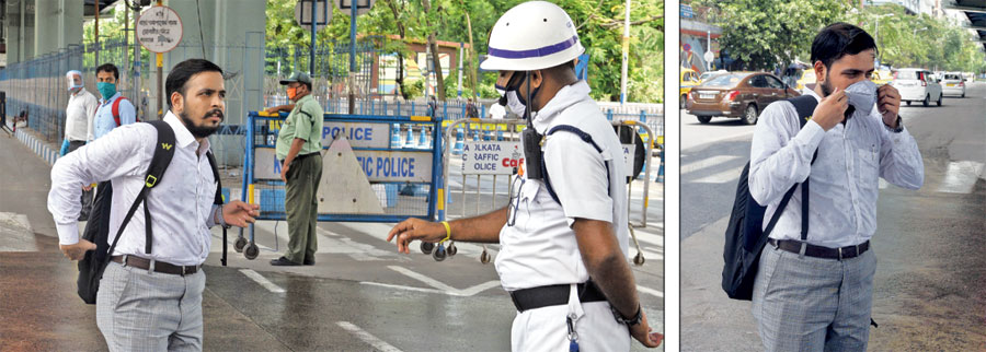 A pedestrian is stopped and made to wear a mask