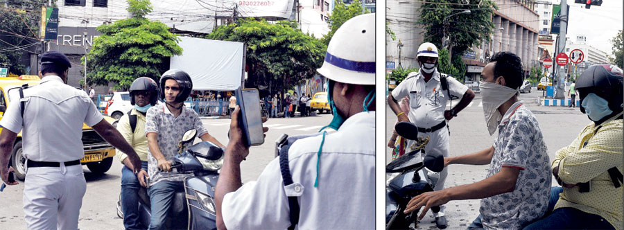 A policeman stops a biker and makes him cover his face