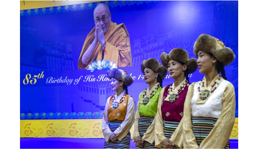 Exile Tibetan artists perform a special song to mark the 85th birthday of their spiritual leader the Dalai Lama in Dharmsala on Monday