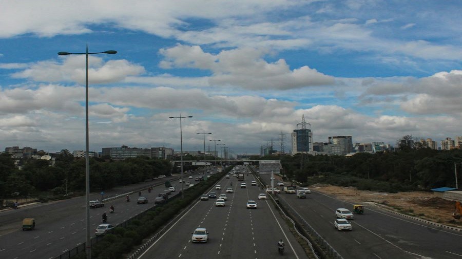 Vehicles ply as monsoon clouds hover in the sky, during Unlock 2.0, in Gurugram, Tuesday, July 7, 2020.