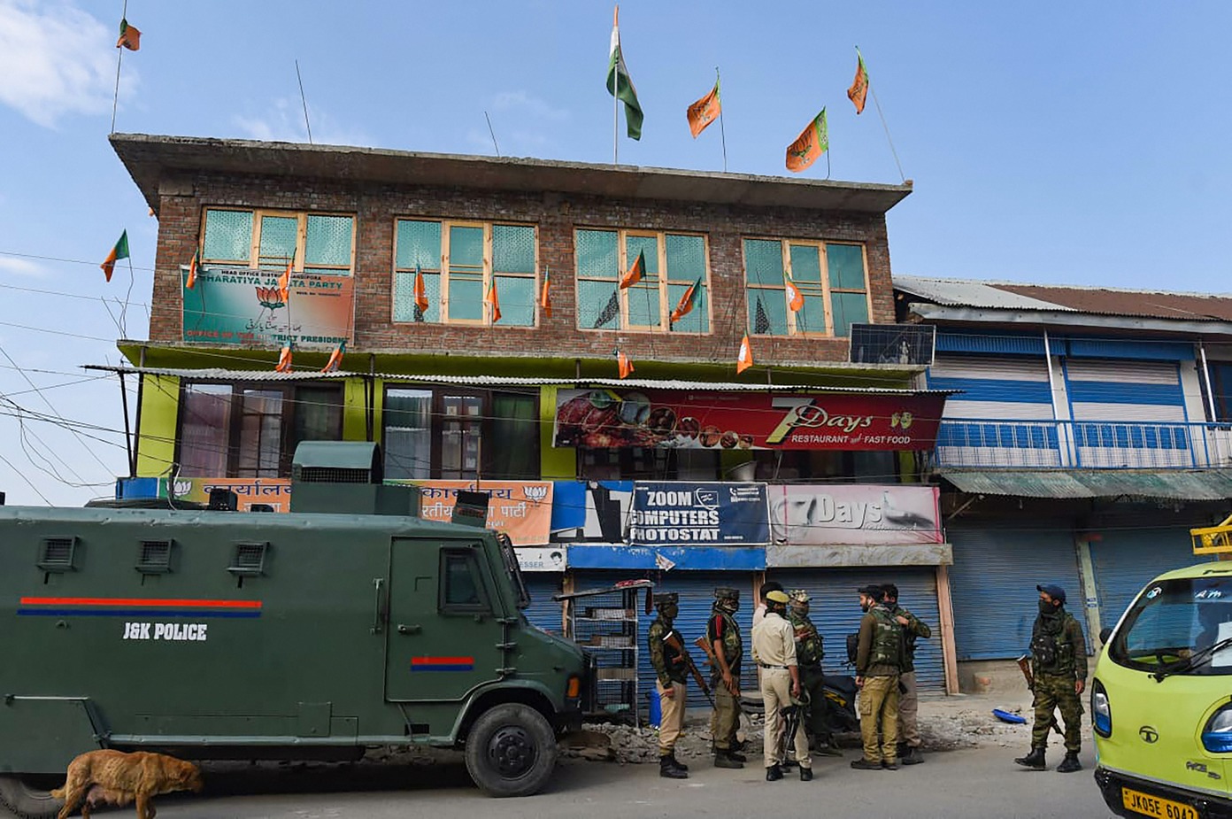 Security forces personnel guard the residence of BJP leader Sheikh Waseem Bari in Bandipora district of Kashmir, Thursday, July 9, 2020.