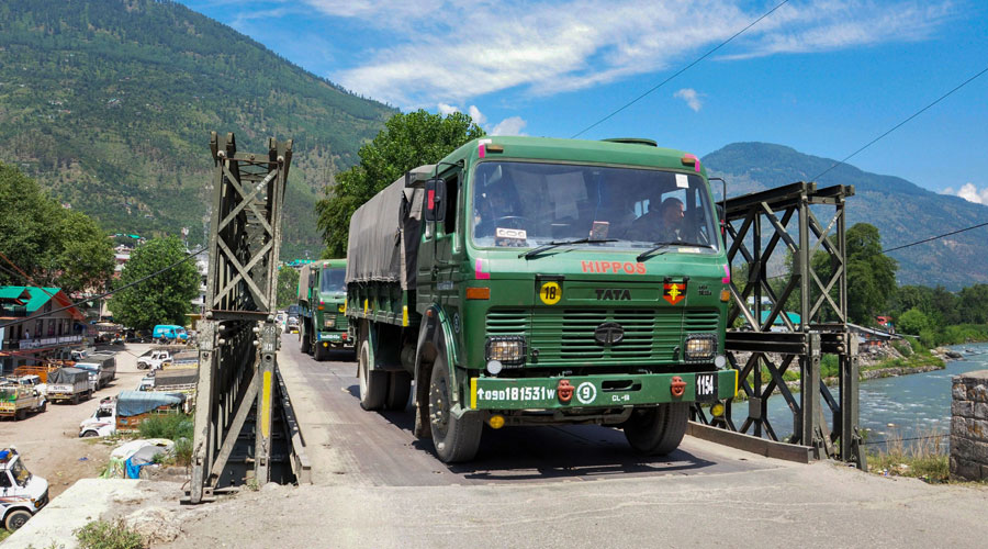 Indian army trucks depart towards Ladakh amid stand off between Indian and Chinese troops in eastern Ladakh, at Manali-Leh highway in Kullu district on Monday.