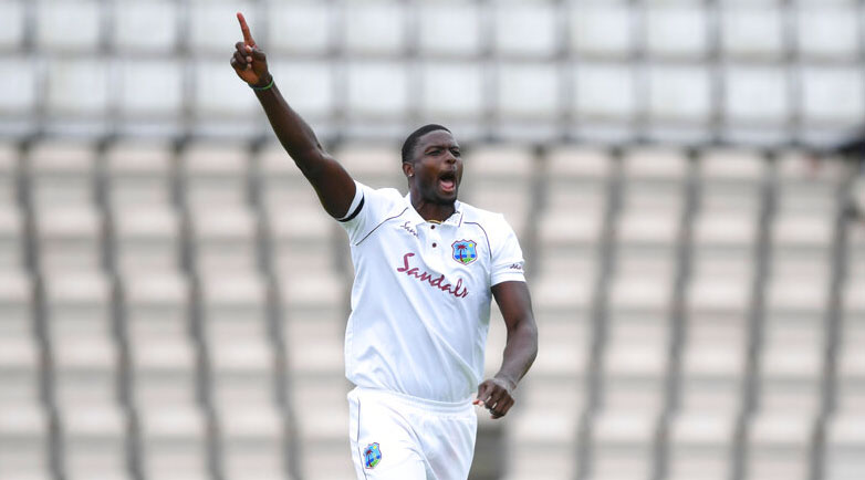 Jason Holder celebrates the dismissal of Jos Buttler during the second day of the first cricket Test in Southampton on Thursday.