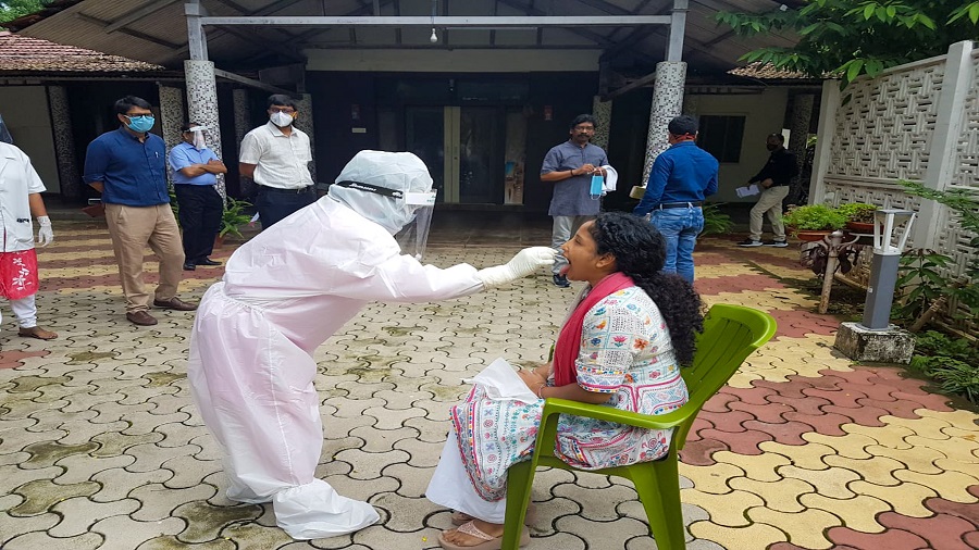 A health worker collects a swab sample of Kalpana Soren, wife of the chief minister, in Ranchi on Saturday