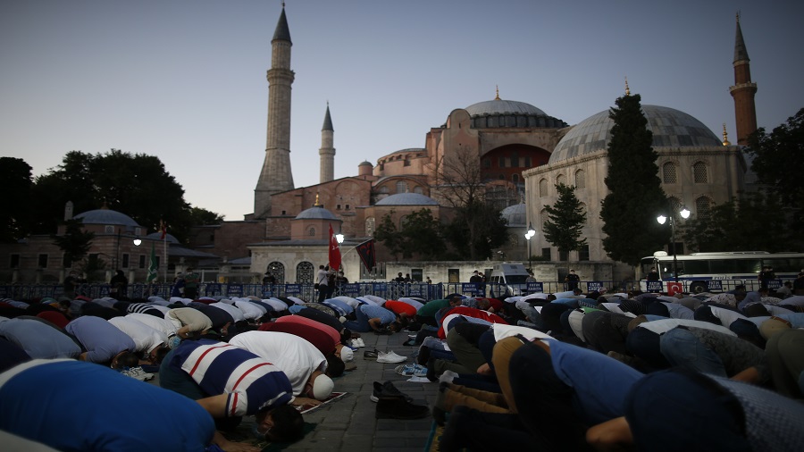 People offer the evening prayer outside the Hagia Sophia on July 10