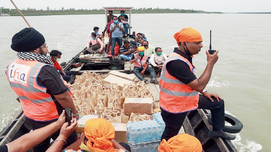 IHA Foundation volunteers distribute relief materials in the remote villages of Sunderbans and South 24 Parganas, post Cyclone Amphan