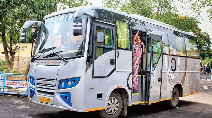 Rajasthan minister Mamta Bhupesh boards a bus after meeting chief minister Ashok Gehlot in Jaipur on Monday. The bus later ferried her  and several other MLAs to a hotel.