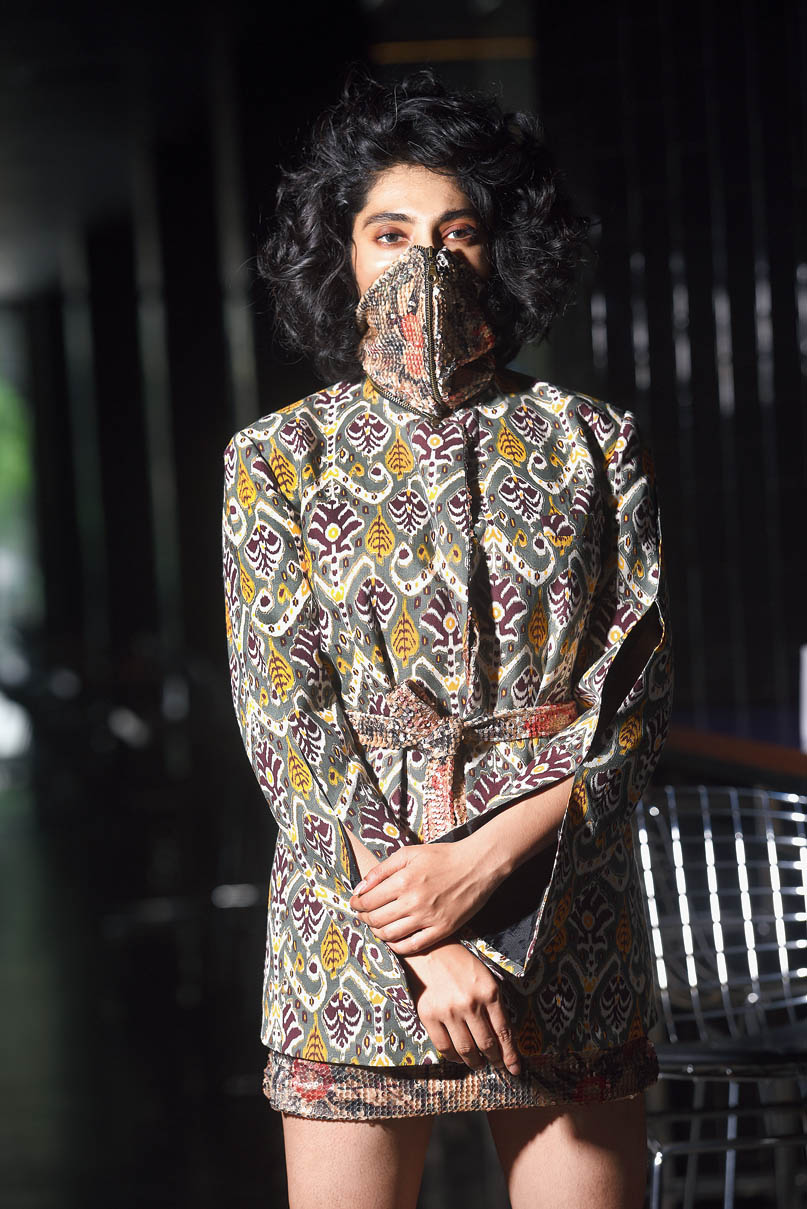 The lapel jacket has been teamed with a sequinned skirt for an edgy look. The detachable mask comes with the jacket and is made of sequins and leather with snakeskin print and metal rivets. “It falls like an exaggerated collar when you unzip the jacket,” says Abhishek. 
