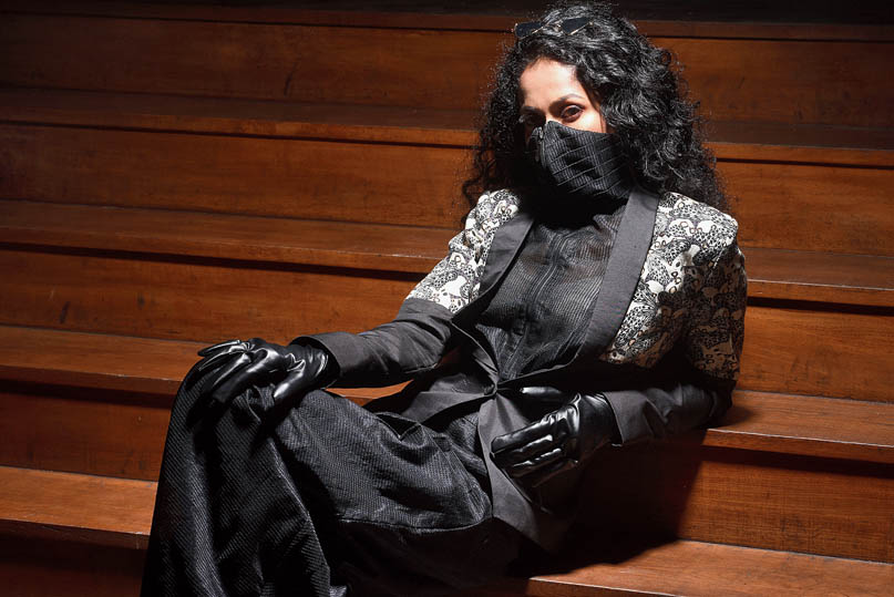 This look on Ushoshi Sengupta is all about dinner drama or a cocktail. A lapel jacket has been paired with a Chanderi top with detachable mask. 