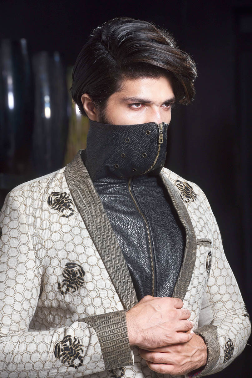 Rock star vibe meets boy next door in this linen lapel jacket and a faux leather vest with an in-built mask, on Mohammed Iqbal. “You can attach the vest and jacket too with a button on the shoulders. All our masks are three layered and have cotton,” says Abhishek. The jacket can be part of a nice brunch look when life resumes!