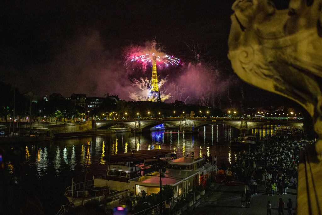 Fireworks illuminate the Eiffel Tower in Paris during Bastille Day celebrations late Tuesday, July 14, 2020.