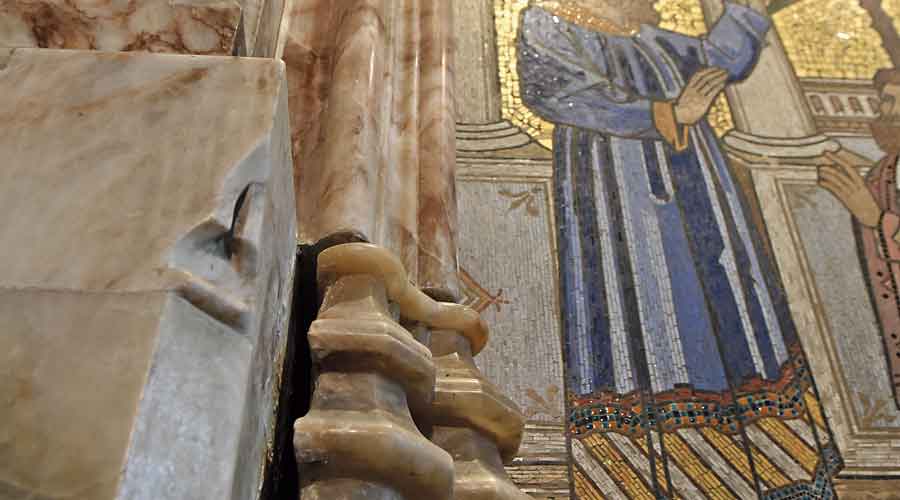 A crack in a wall with a fresco