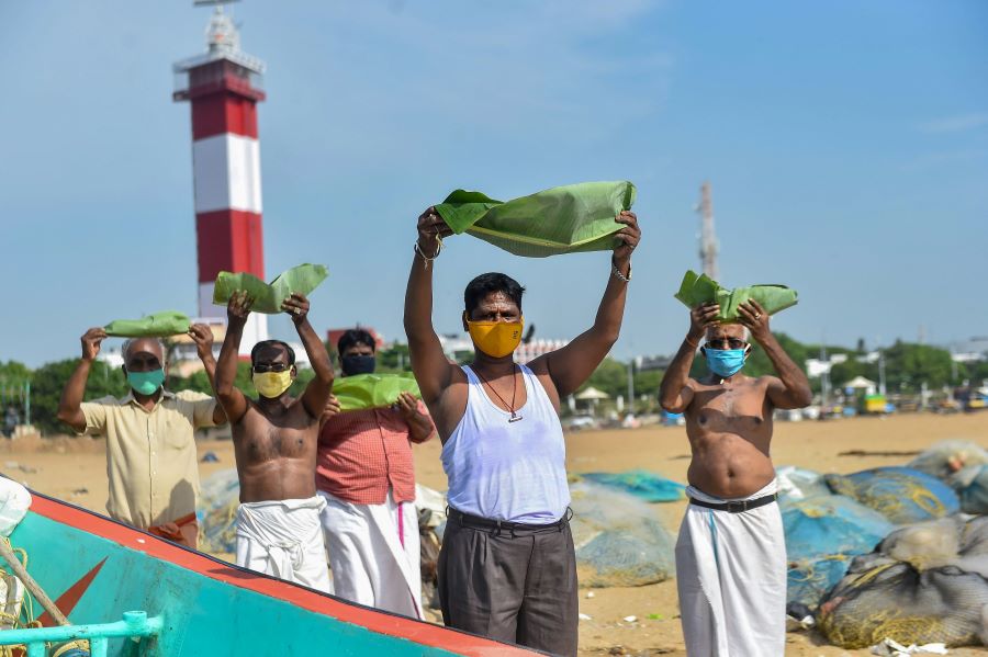 People perform rituals for salvation of their ancestors on the occasion of Aadi Amavasya at Marina Beach, in Chennai, Monday, July 20, 2020. 