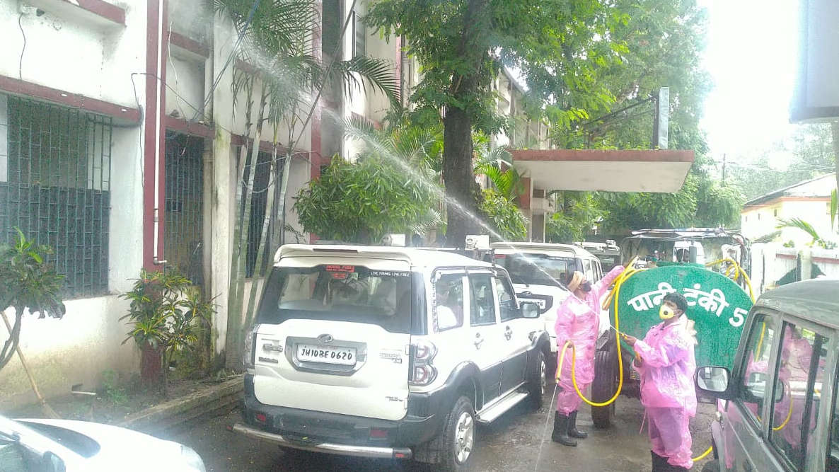 Dhanbad Municipal Corporation employees spray chemicals to sanitise the district collectorate on Monday. 