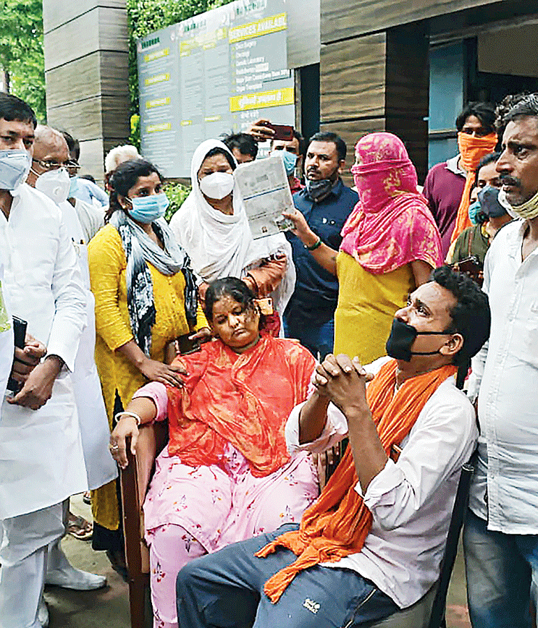 Family members of Vikram stage a protest demanding justice for him in Ghaziabad on Wednesday .