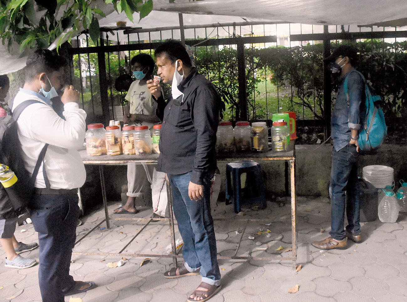 The tea seller in front of the CGO complex, Dibakar Naik, said awareness had dawned upon customers and that they were all coming in masks now. Police are also making frequent announcements to enforce social distancing. Customers have dwindled too. “We have switched to having self-made tea in our offices” said Raja Ghosh. “I’ve only come today as tea in office has got exhausted.” Pictures by Mayukh Sengupta