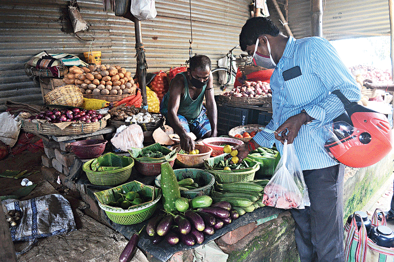 A customer buys lemons at Baisakhi Market.