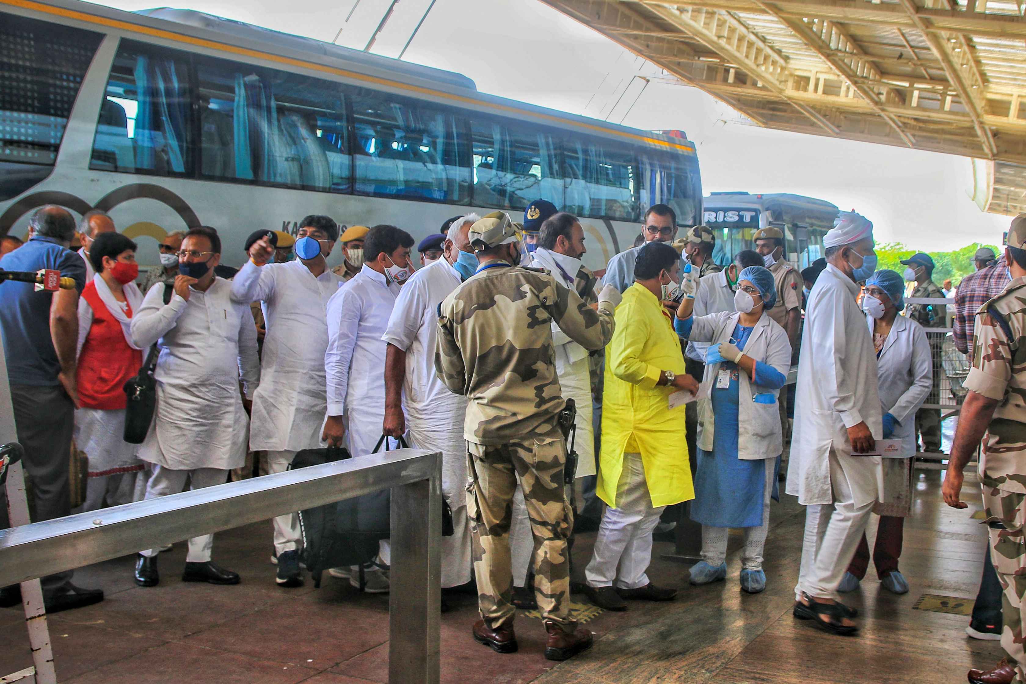 Rajasthan Congress MLAs arrive at Jaipur Airport as they shift to Jaisalmer, in Jaipur, Friday, July 31, 2020