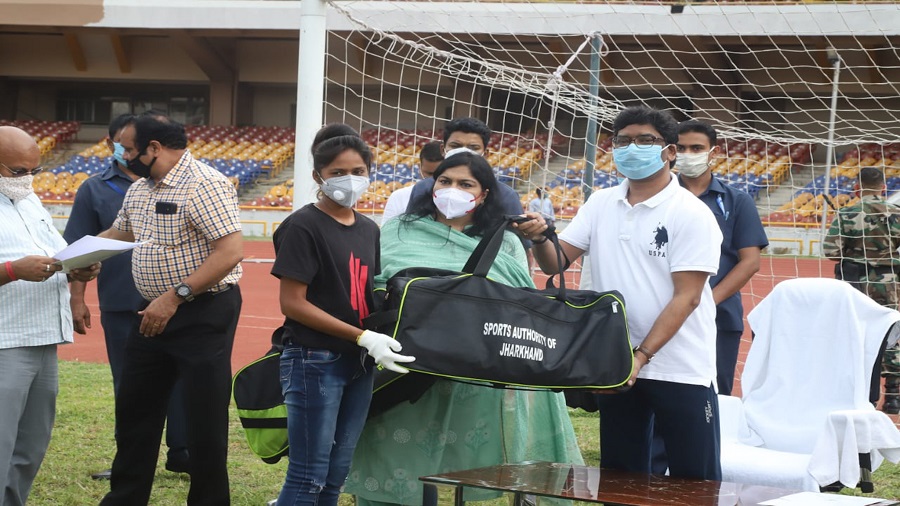 Chief minister Hemant Soren hands over a football kit bag with goodies to one of the players set to represent India in the U-17 Women’s World Cup at Morhabadi Stadium in Ranchi on Thursday