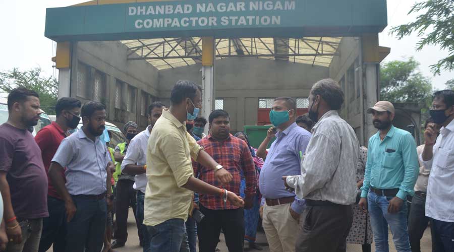 Dhanbad Municipal Corporation and Ramky Enviro Engineers Ltd officials at the Hirapur compactor station on Tuesday.