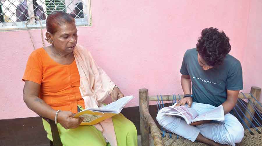 Raju Kumari tutors a boy