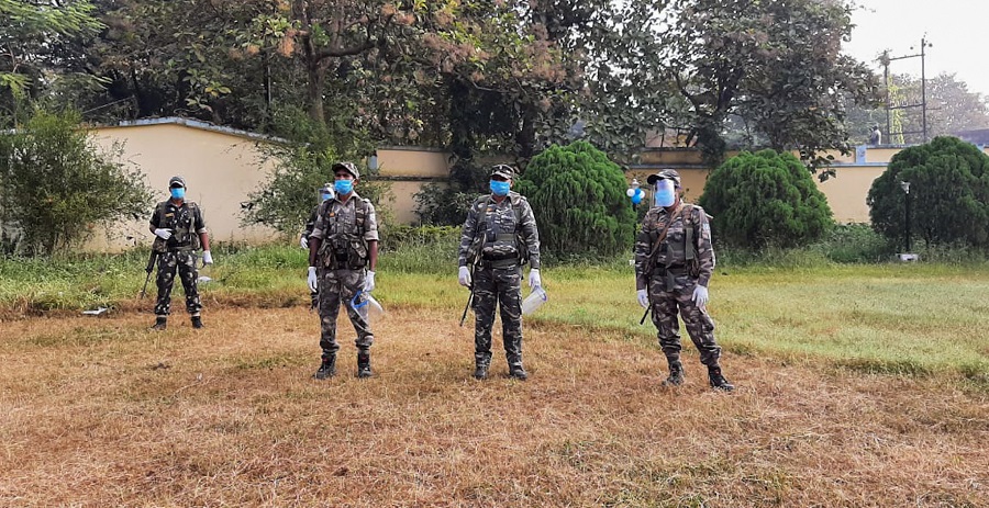 CRPF personnel on standby at a polling booth in Bermo on Tuesday.
