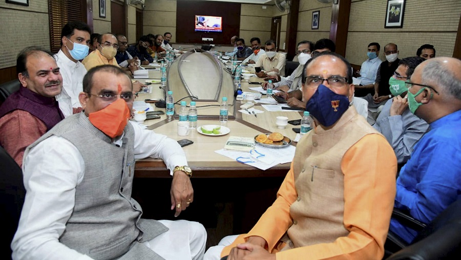 Madhya Pradesh Chief Minister Shivraj Singh Chouhan with BJP State President VD Sharma during a meeting, at party HQ in Bhopal on Tuesday.