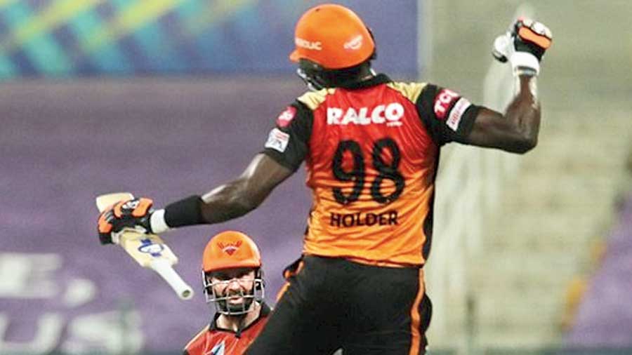 Sunrisers Hyderabad’s Jason Holder and Man of the Match Kane Williamson celebrate after winning the game against Royal Challengers Bangalore in Abu Dhabi on Friday. 