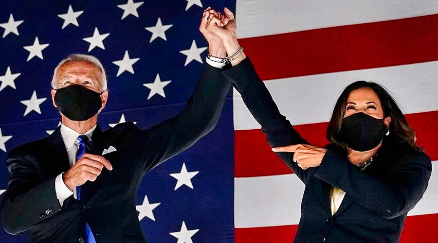 US President-elect Joe Biden and Vice President-elect Kamala Harris holds hands as they celebrate after winning the election.