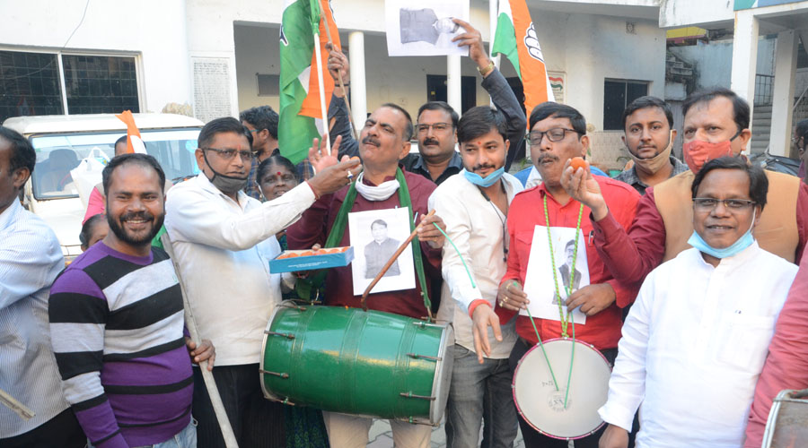 Congress workers celebrate after the victory of their candidate in Bermo at the party office in Ranchi on Tuesday.