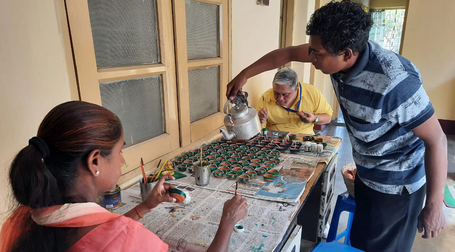 A special student pours wax on diyas at Jeevika in Jamshedpur on Tuesday.