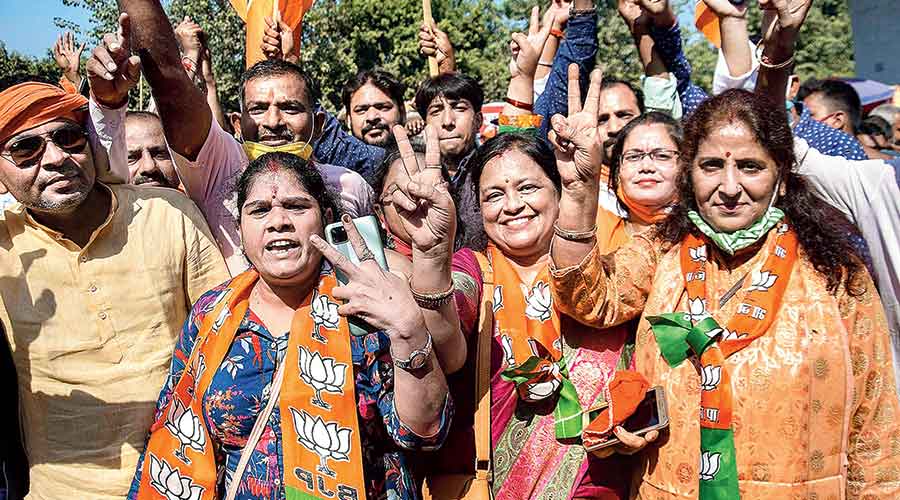BJP workers celebrate NDA’s victory in the Bihar polls in Patna. 
