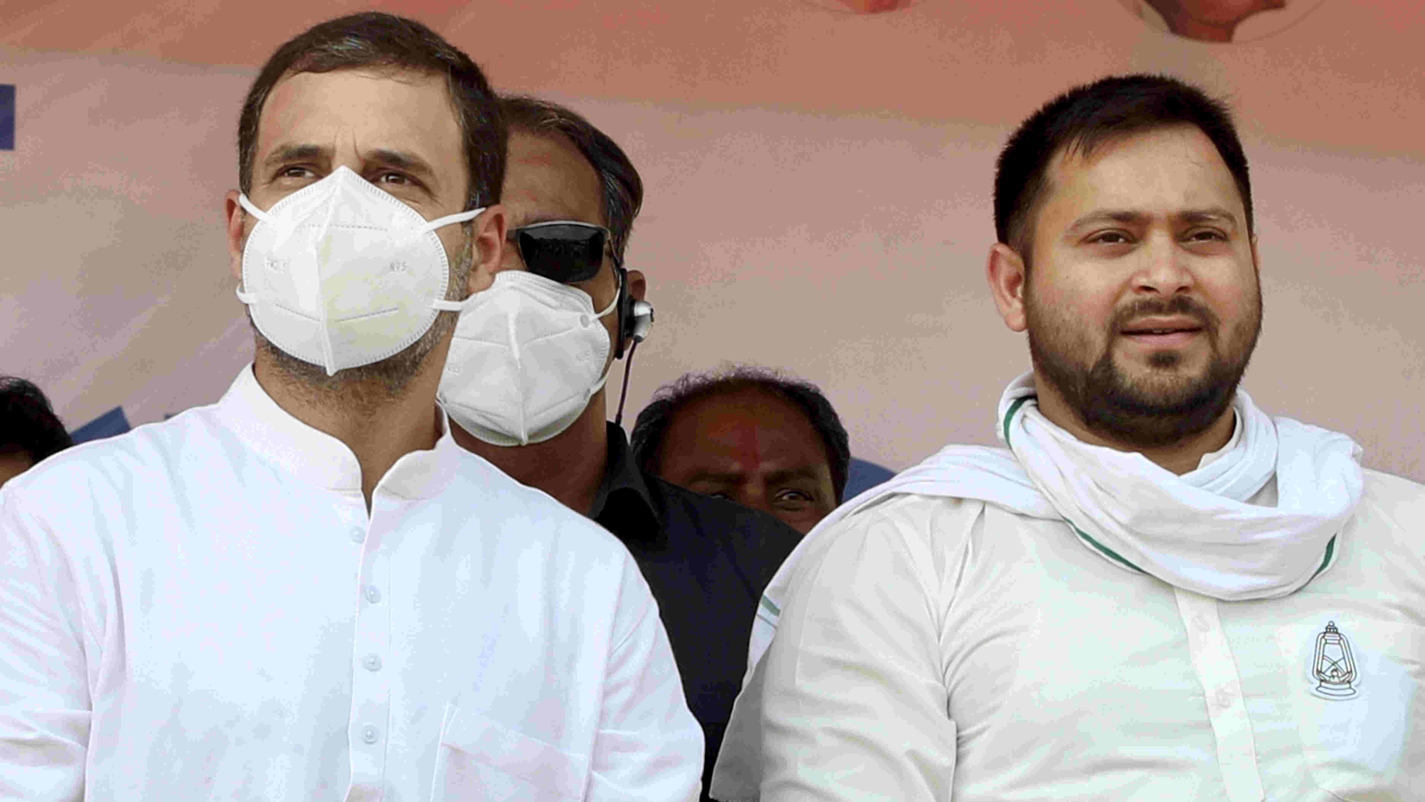  In this Friday, Oct. 23, 2020 file photo, Congress leader Rahul Gandhi along with RJD leader Tejashwi Yadav during an election meeting, at Hisua in Nawada district. 