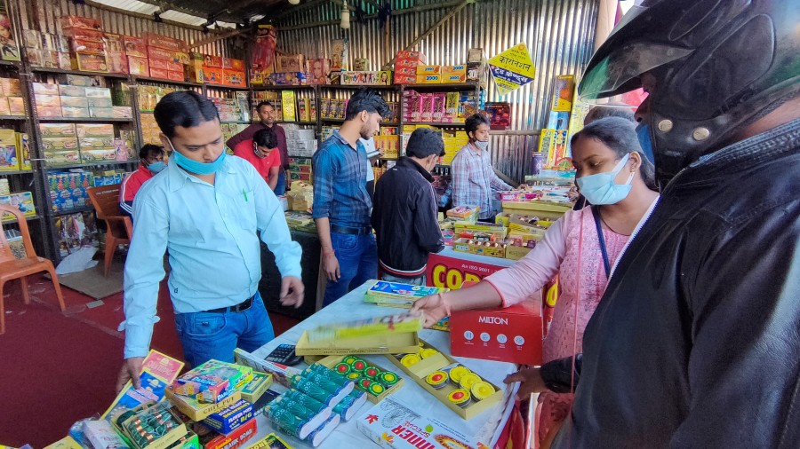 Customers buy firecrackers ahead of Diwali at Jaipal Singh Munda Stadium in Ranchi on Thursday. 