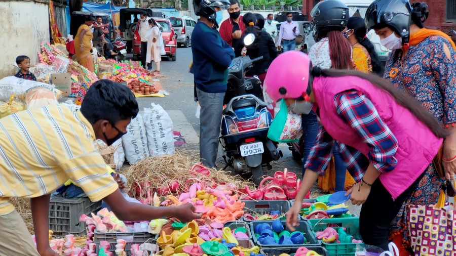 Customers buy diyas and mud toys before Diwali in Ranchi on Thursday. 