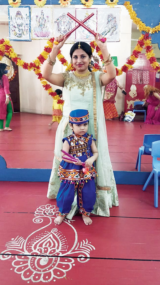 A mother and her son shake a leg