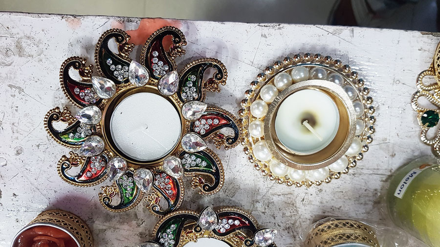 Stonework candle stands at Sri Guru Bhandar, IA Market