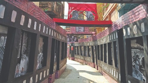 The decorated approach to the Kalighat Nepal Bhattacharjee Street Club pandal near Kalighat Metro station