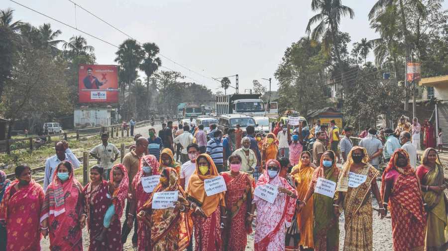 Women protest against the poor condition of NH12 in Govindapur of Santipur on Wednesday.