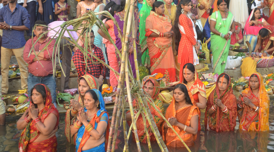 Devotees perform Chhath Puja during the Sandhya Arghya on Damodar river at Sudamdih river side, Dhanbad on Friday.
