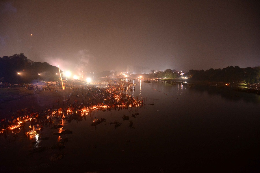 Diyas lit by devotees float at the Subernarekha ghat in Sakchi on Saturday morning.