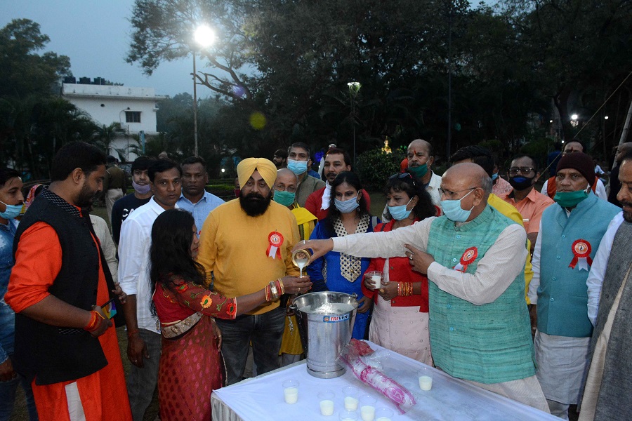 Local legislator Sarayu Roy distributes milk on the premises of Surya Mandir on Saturday morning.