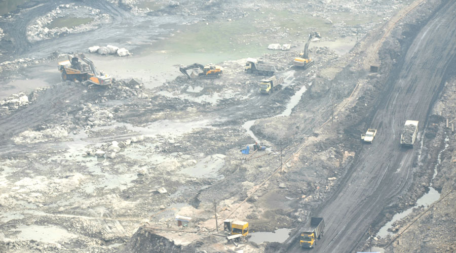 Machine and tipper trucks carrying coal from an opencast mine of Bharat Coking Coal Limited (BCCL) in Jharia during the nationwide trade union strike on Thursday.