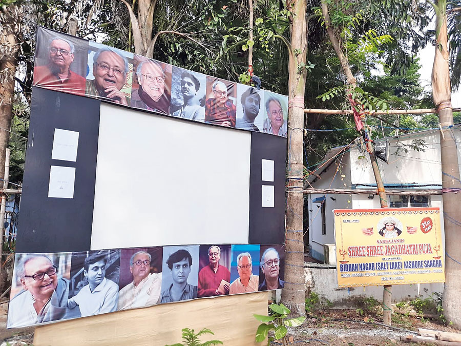 The big screen outside the Bidhannagar (Salt Lake) Kishore Sangha’s pandal played Soumitra films