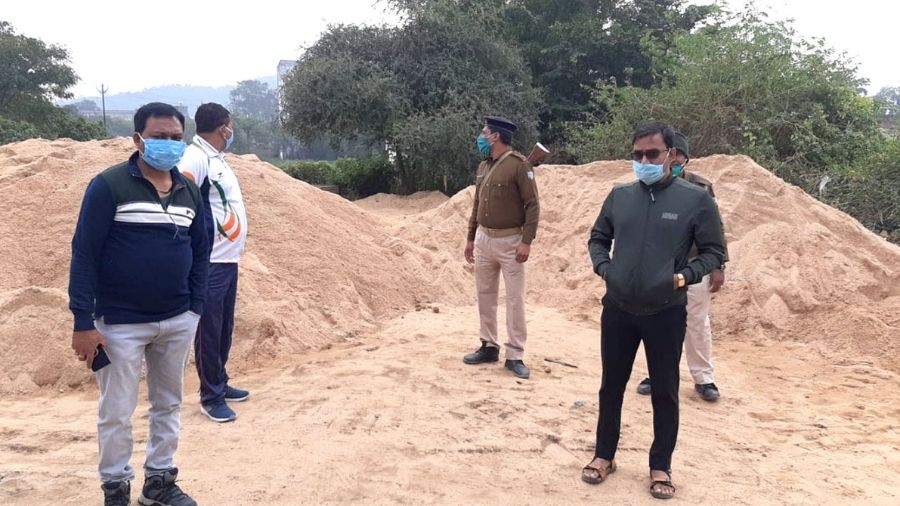 Dhanbad SDM, Surender Kumar (in right) along with other district administrative officials during the raid at an illegal sand deport near Goal Building under the Saraidhela police station in Dhanbad