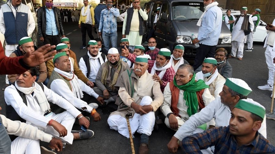 Protesting farmers hold a sit-in at Delhi border.