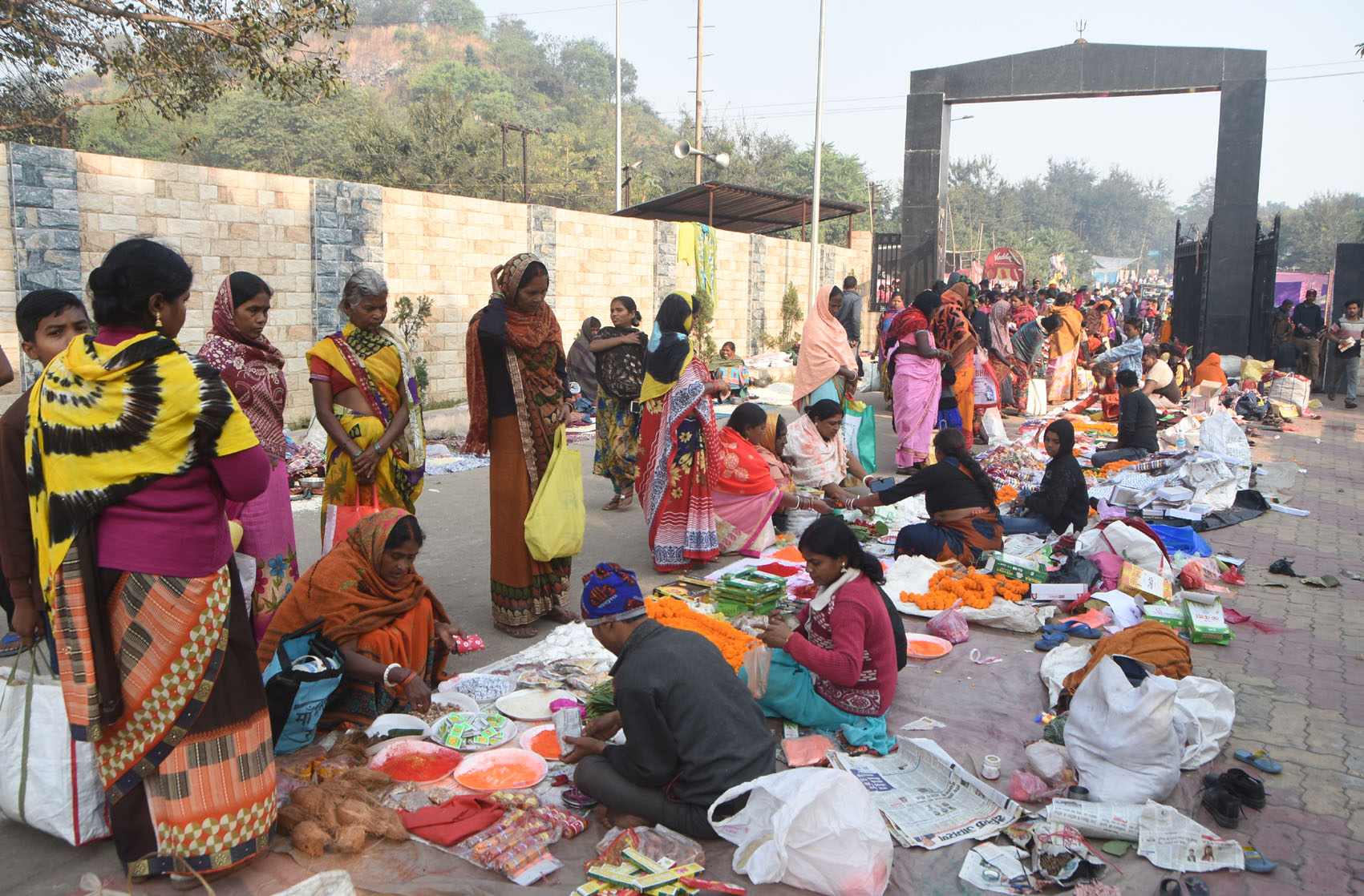 Devotees buy puja paraphernalia before a holy dip at Mohalbani Ghat in Dhanbad on the occasion of Kartik Purnima on Monday. 
