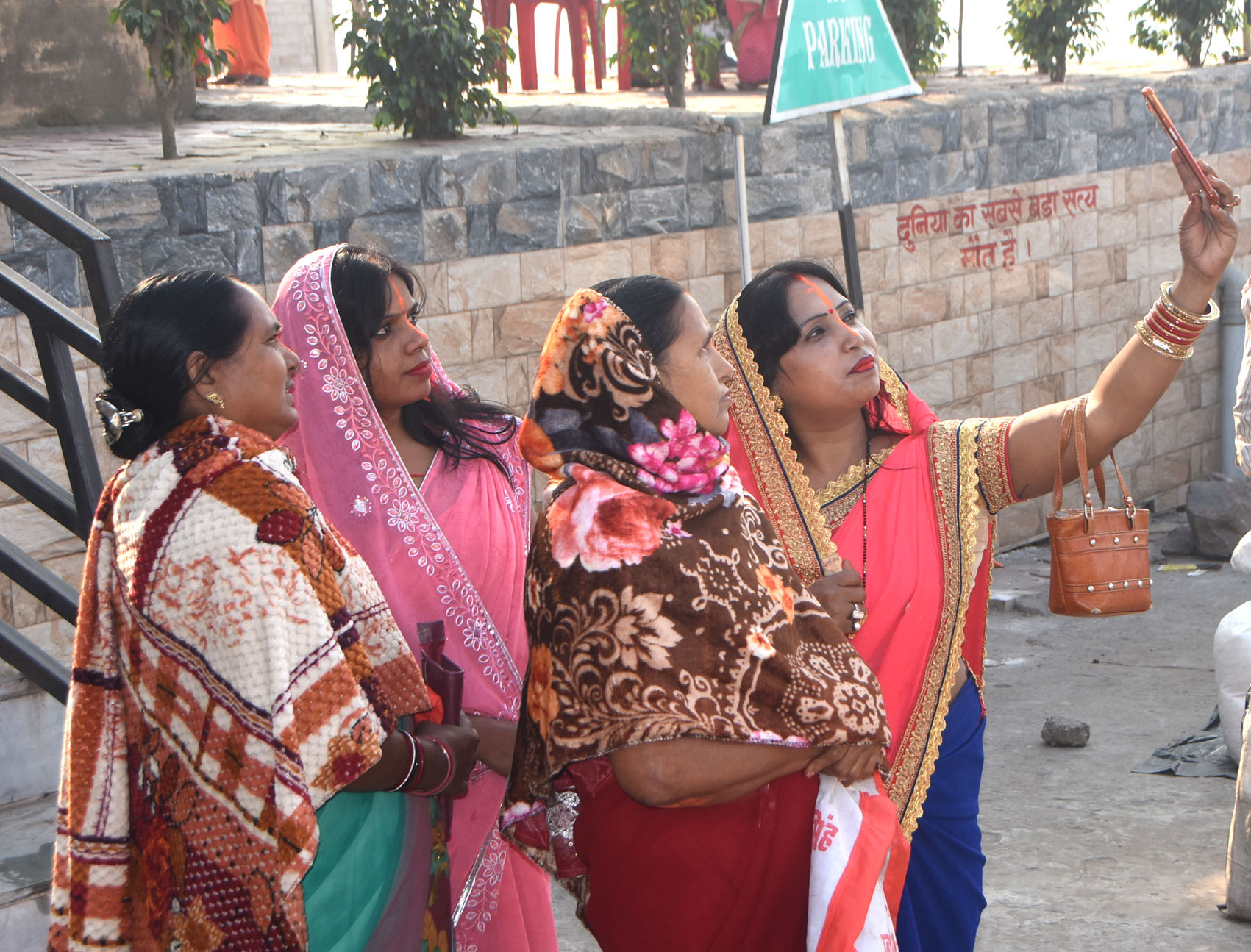 A family takes a groupfie on the bank of river Damodar at Mohalbani Ghat in Dhanbad on the occasion of Kartik Purnima on Monday. 
