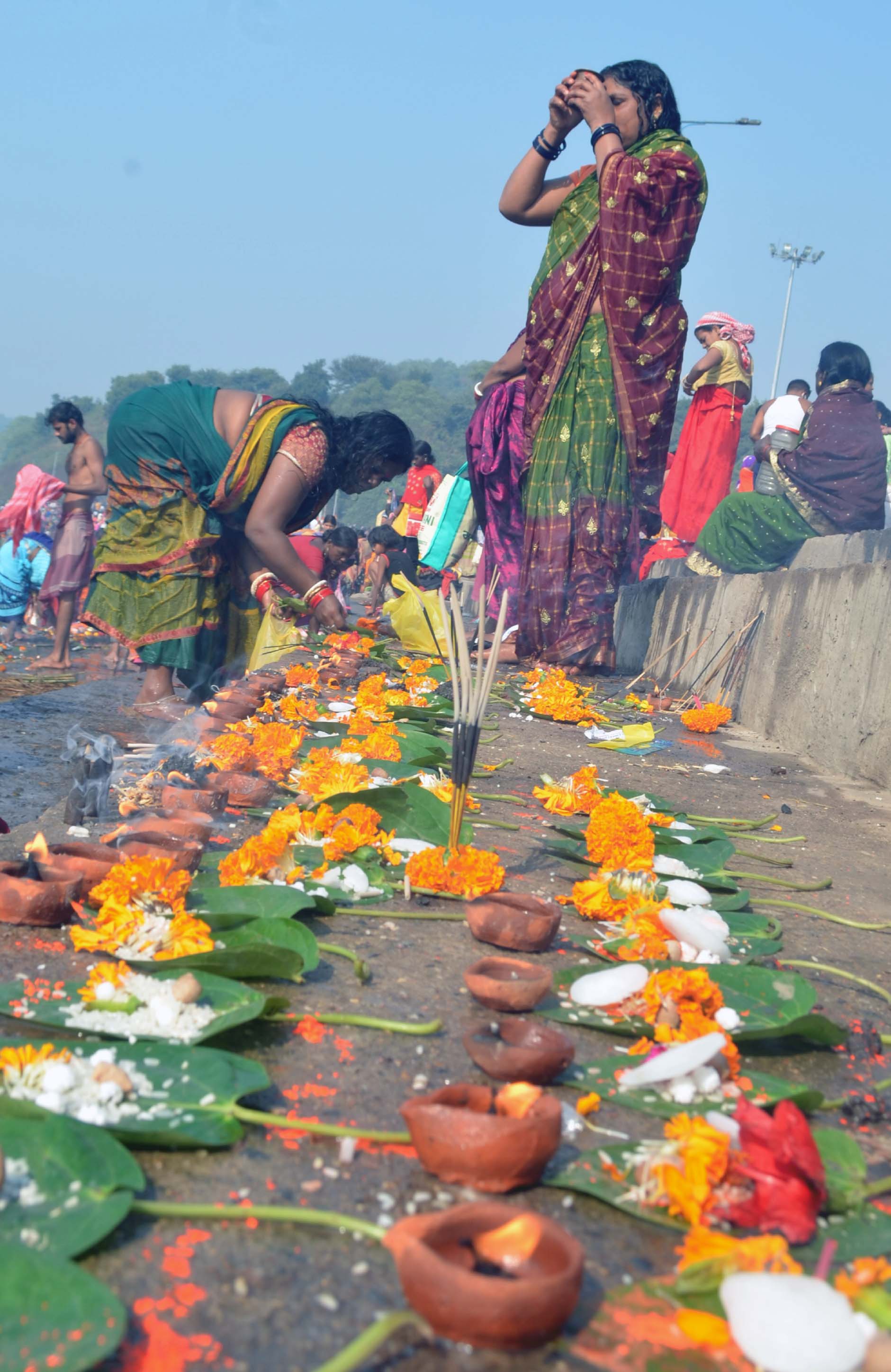 Devotees perform rituals on the occasion of Kartik Purnima and Dev Diwali on the bank of Damodar river at Mohalbani Ghat, Dhanbad on Monday. 