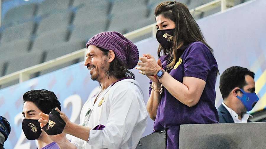 Kolkata Knight Riders principal owner Shah Rukh Khan cheers on the team with son Aryan after the win over Rajasthan Royals in Dubai on Wednesday.